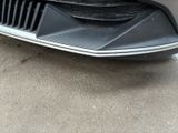 a close up of a car ' s front bumper and grille