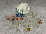 a lot of glasses and a plate on the table