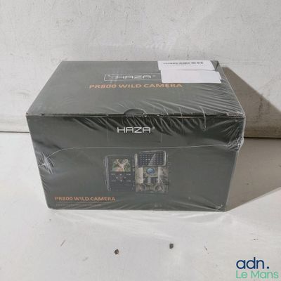 packaging for a camera with a box on a white surface