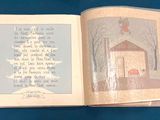 an open book with a picture of a house on it