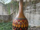 a vase that is sitting on top of a wall