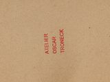 a brown book with red writing on it
