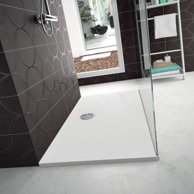 a shower with a glass door in a bathroom