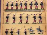 a lot of figurines of soldiers that are in a box