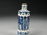 a blue and white vase with a design on the outside