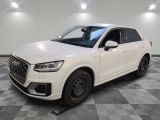 the white audi suv is parked in a clean room