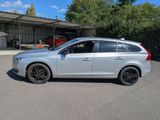 a picture of a silver volvo wagon parked in a parking lot