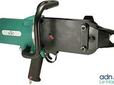 a close up of a green and black machine on a white background