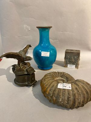 a blue vase, a blue vase, and a blue vase on a table