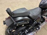 a motorcycle that is parked on the street in the parking lot