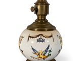 an image of a white and gold vase with a bird on it