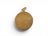 a close up of a gold plated pendant on a white background