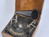an old fashioned record player sitting in a wooden box