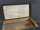 an old black suitcase with a sign in it