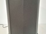 a close up of a speaker sitting on top of a table