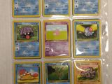 a lot of pokemon cards that are on the table