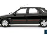 the black car is parked on a white surface with a red stripe