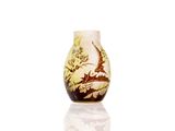 a vase that has a picture of a bird on it