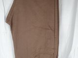 men ' s khaki pants on a hanger on a white background