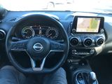 the interior of a car with a steering wheel, dashboard, and dash board
