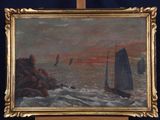 painting on easel of sailboats in the ocean at sunset