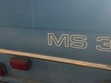 an image of a blue truck parked in a garage