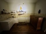 a kitchen with a sink and a wooden cabinet in it