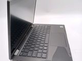 a black laptop with a black keyboard on a white surface