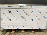 a white box with blue arrows on it sitting on a pallet