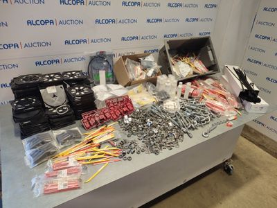 a table with many different items on it in front of a wall
