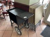 a cart with a table on wheels in a restaurant