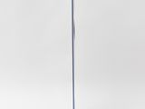 a blue and white sculpture on a metal stand