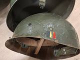 two helmets that are sitting on a table