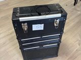 a black suitcase sitting on the floor in a room