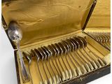 many spoons and forks in a case on the table