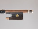 a close up of a violin bow with a wooden handle