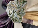 a close up of a tie with a flower on it