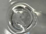 a close up of a glass of water on a table