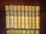 a lot of books that are sitting on a shelf