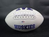 a close up of a football with the word huskies on it