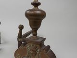 pair of antique wooden candlesticks with ornate carvings on top