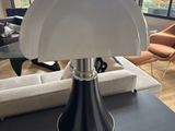 a lamp that is sitting on a table in a living room
