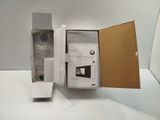 a box with a phone inside of it on a table