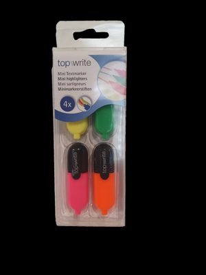 three different colored pens in a package on a black background