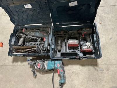 a tool box with tools inside of it on the floor