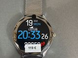 the watch is sitting on a table with a price tag on it