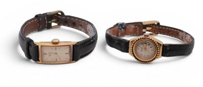 pair of ladies ' s wrist watches with black leather strap and gold tone dial