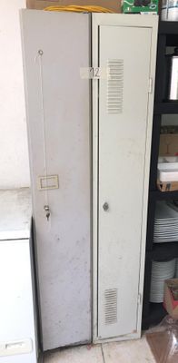 a metal cabinet in the corner of a room