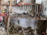 a workbench with many tools on it in a garage
