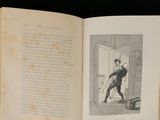 an open book with a picture of a man holding a dog